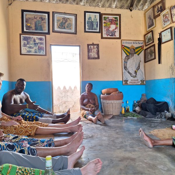 Visiting a vodoo shrine in group in Togo